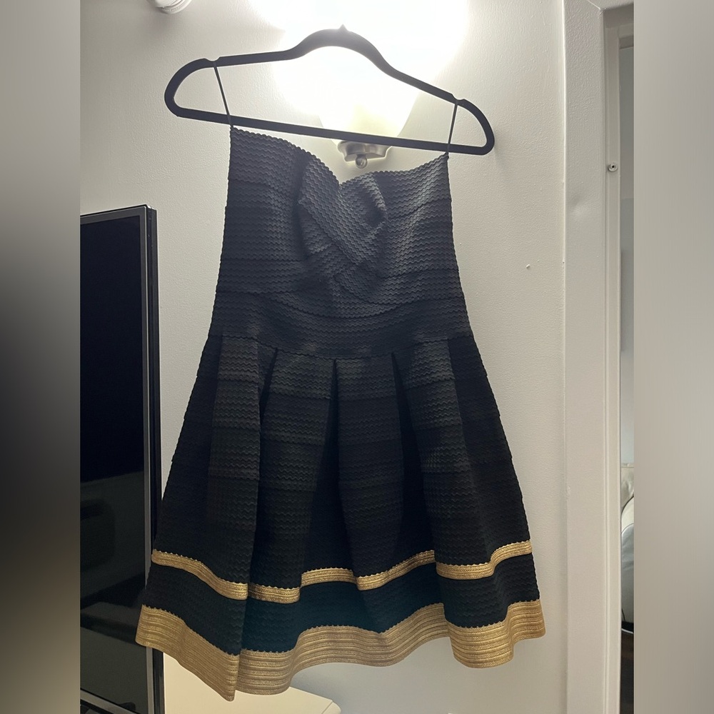 Never worn. With tags. Women’s Alythea Black and Gold Dress. Size Large